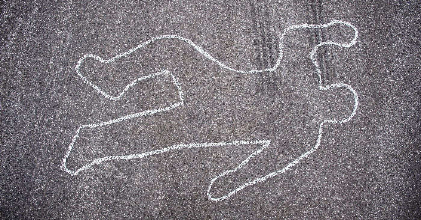 The chalk outline of a murdered individual at the scene of a crime where Murder Defense Lawyers in Peoria IL are investigating