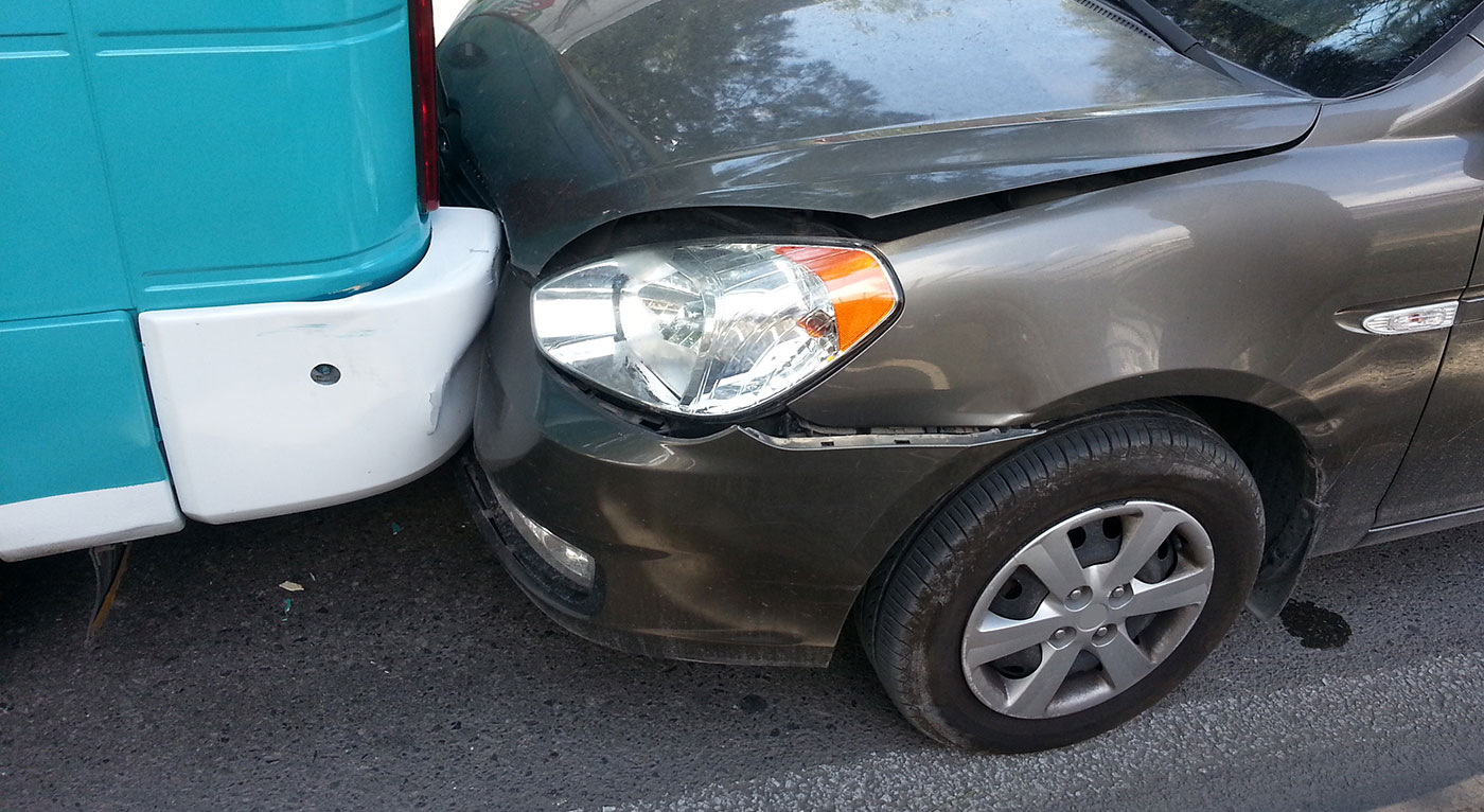 A damaged car in a fender-bender, needing assistance from Rear-End Accident Lawyers in Peoria IL