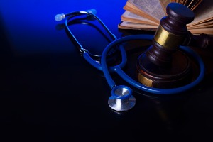 A gavel with a doctor's stethoscope around it, representing a Personal Injury Lawyer in Peoria IL